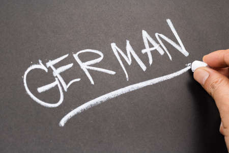 Hand writing German word on chalkboardの写真素材