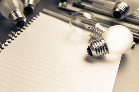 Light bulb on piece of paper for creative writing concept