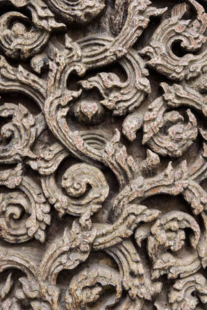 Ancient teak carve on the temple door at Wat Don Sak, Uttaradit, Thailand