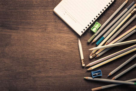 Writing equipment on wood desk with copy spaceの写真素材