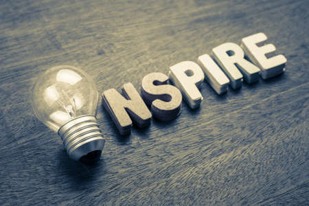 Glowing light bulb for Inspire wordの写真素材