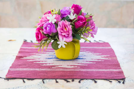 Artificial bouquet on marble tableの写真素材