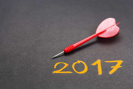 Handwriting of 2017 on chalkboard with dartの写真素材