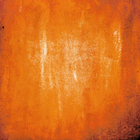 Orange color painted on old paper textureの写真素材