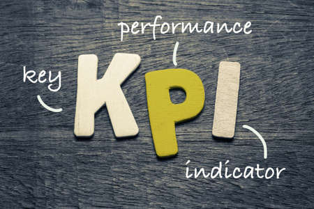 KPI (key performance indicator) on wood backgroundの写真素材