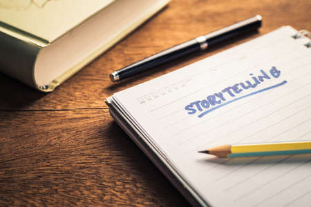 Handwriting of Storytelling text on notebook on the deskの写真素材