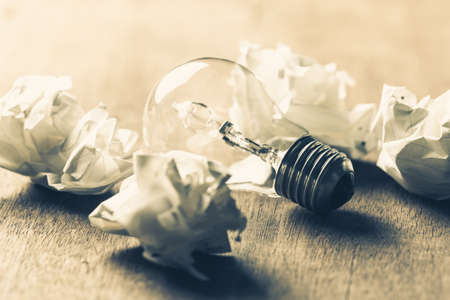 Usable Idea, closeup light bulb in the group of crumpled ball paperの写真素材