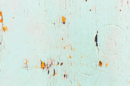 Old green wood board with chipped paintの写真素材