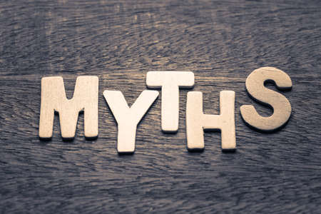Wood letters of MYTHS word on wood backgroundの写真素材