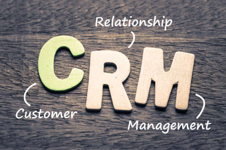 Wood letters of CRM and definition on wood backgroundの写真素材