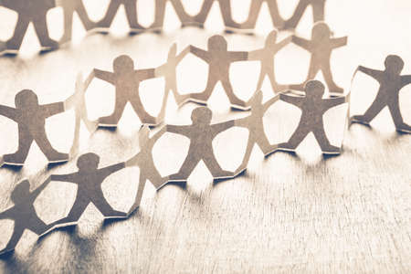 Human chain paper as a crowd people symbol