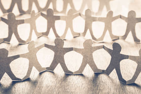 Human chain paper as a crowd people symbolの写真素材
