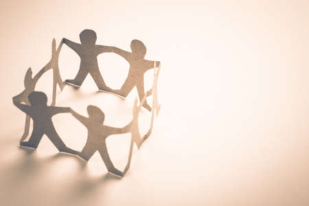 Human chain paper in circle with space for textの写真素材