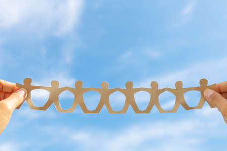 Hand show human chain paper on blue sky