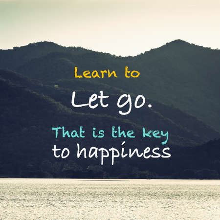 Learn to Let go, That is the key to happiness  - inspiration quote on nature backgroundの写真素材