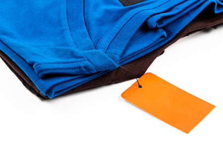Closeup t-shirt and price tag on white backgroundの写真素材