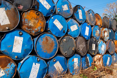 Stack of old oil tanks at train station