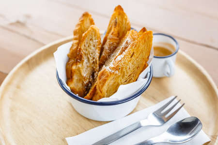Afternoon light meal with sliced croissant