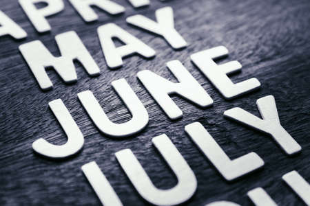 Closeup wood letters of June in running name of monthの写真素材
