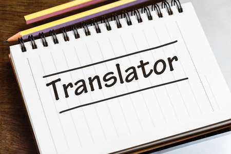 Closeup Translator word on small notebook on the desk