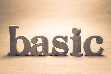 BASIC wood word on brown paper backgroundの写真素材