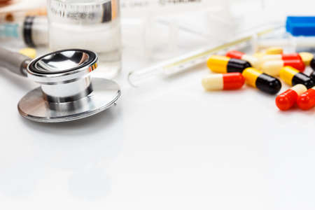 Stethoscope on white medical  table with copy spaceの写真素材