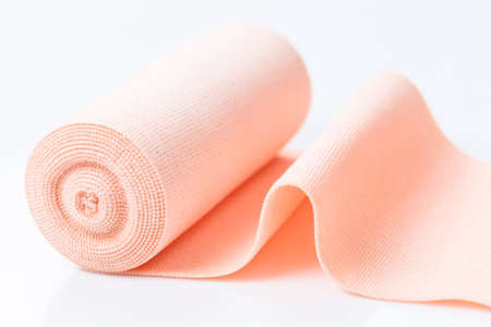 Roll of medical elastic bandage on white backgroundの写真素材