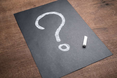 Question Mark drawing with chalk on black paper