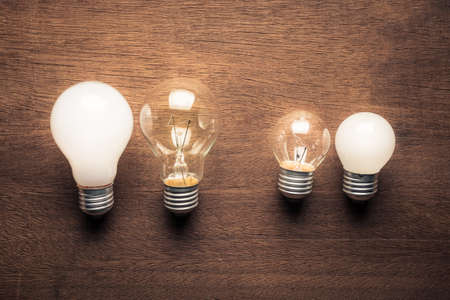 Different style and size of light bulbs in comparison conceptの写真素材