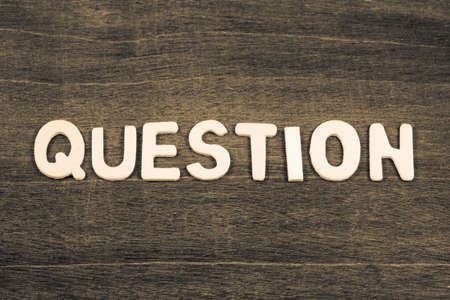 QUESTION word by wood letters arranged on wood background