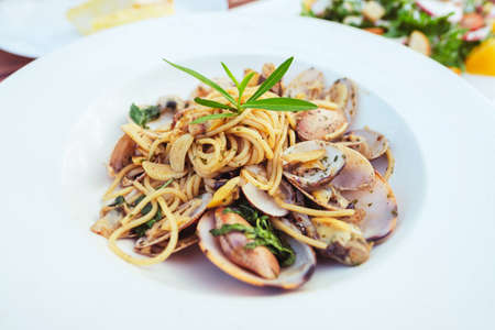 Stir-fried spaghetti and clams with garlic and pepperの写真素材