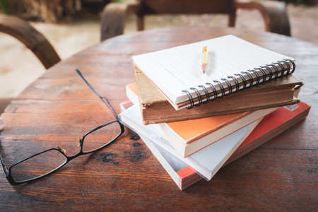 Pile of pocket books for memo note in the backyard at home, research information to write