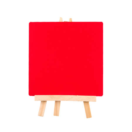 Red wood board on tripod easel isolated on white background, object for insert text with clipping pathの写真素材
