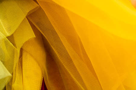 Abstract and  of yellow organza cloth, closeup decorative drapeの写真素材