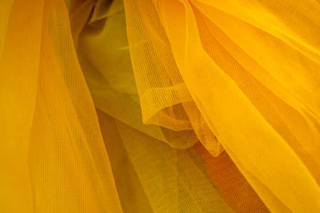 Abstract and  of yellow organza cloth, closeup decorative drapeの写真素材