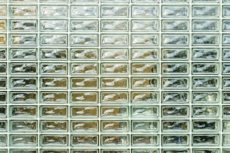 Closeup glass blocks wall of modern building, pattern glass blocksの写真素材