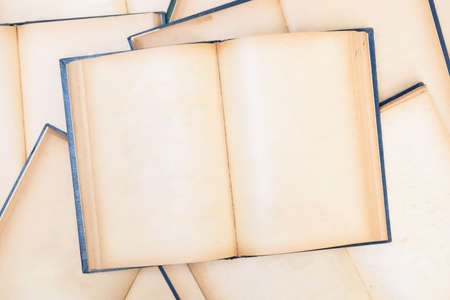 Empty pages of many opened old books on the pile, book  or reading conceptの写真素材