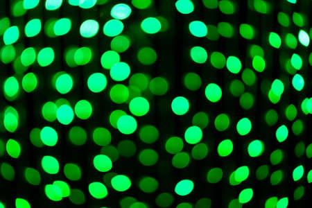 Abstract background, defocused green light of Christmas holiday at nightの写真素材