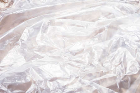 Closeup wrinkled plastic bag spread on the table as plastic texture
