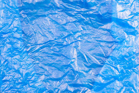 Closeup wrinkled plastic bag spread on the table as plastic texture