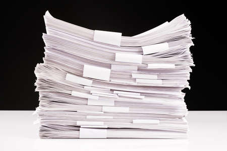 Pile of paperwork that binding in each category, many document file to manage on the white tableの写真素材