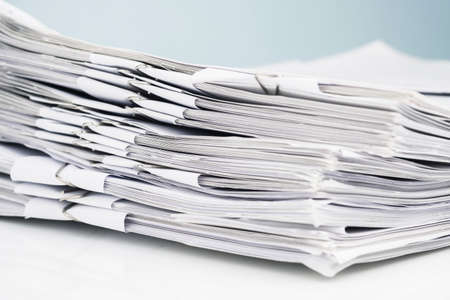 Pile of paperwork that binding in each category, many documents to manage on the table