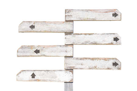 Old wooden signpost painted in white with multiple direction, isolated on white backgroundの写真素材