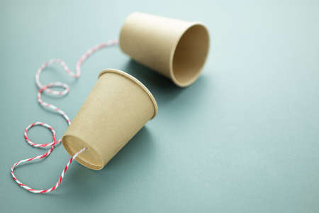A classic phone made from disposable cups and string, telecommunication and phone development conceptの写真素材