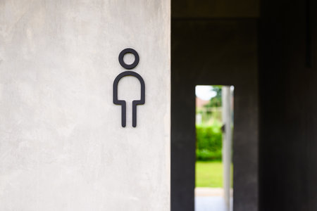 Men toilet sign on concrete wall outside the public toiletの写真素材