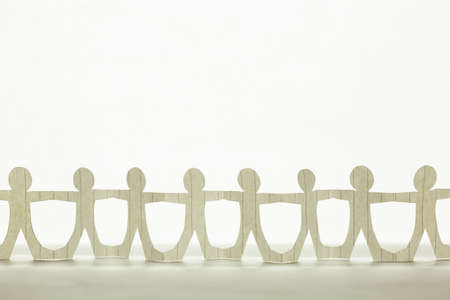 Paper human chain on clear white background, teamwork, people join together, and friendship concept