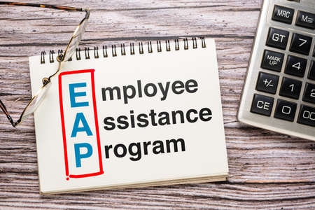 Employee Assistance Program or EAP text on opened notebook on the deskの写真素材