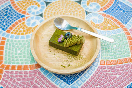Matcha Cake on Mosaic Tableの写真素材