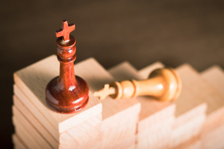 Winning King chess get ahead on the high level with a rival struggle at the lower step, competition and success, career progress conceptの写真素材