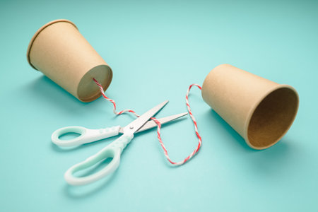 Old style cup phone with scissors to cut the string, a concept for lose, or cut contact,...